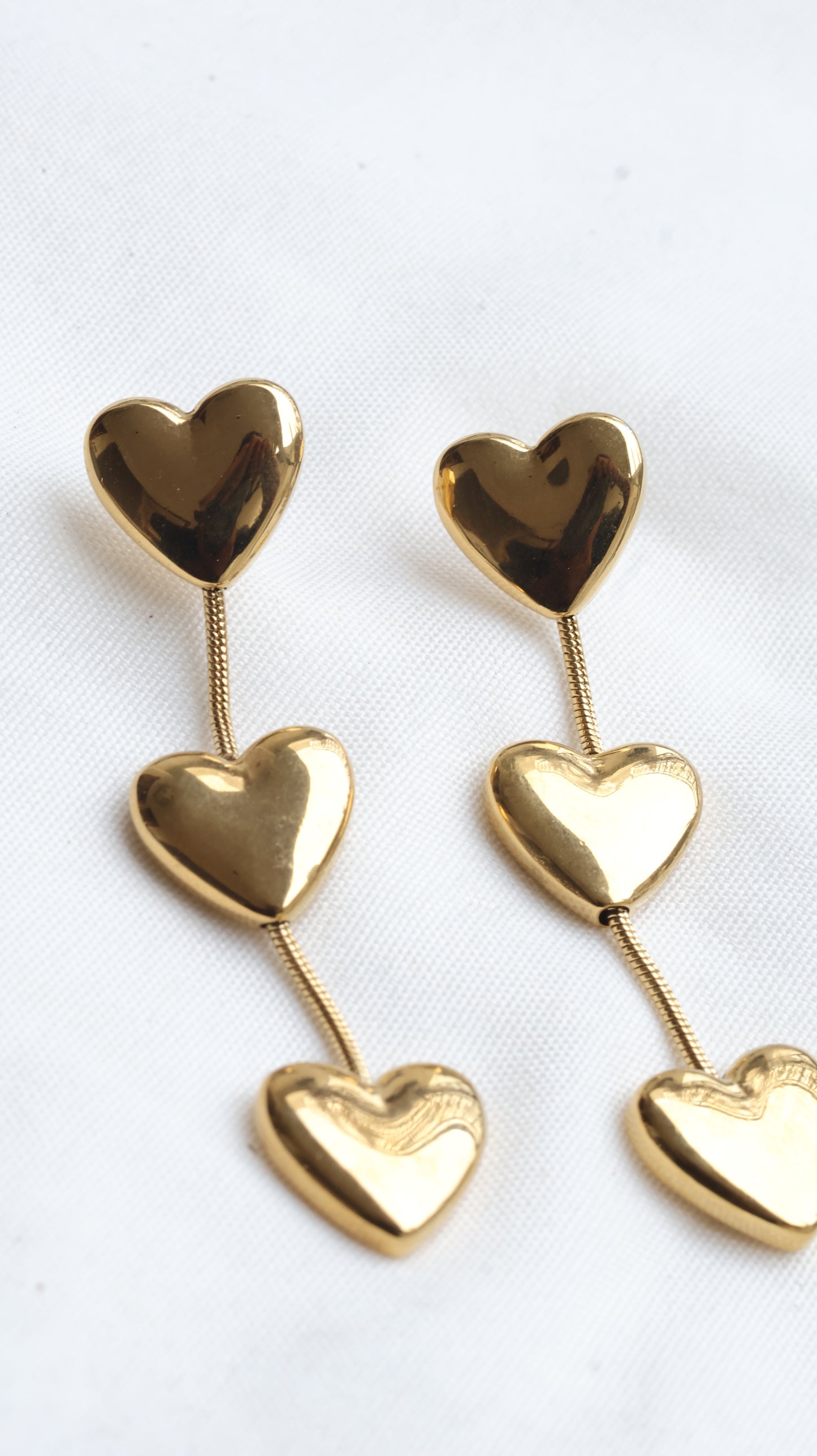 A Golden Triple Heart Drop Earrings